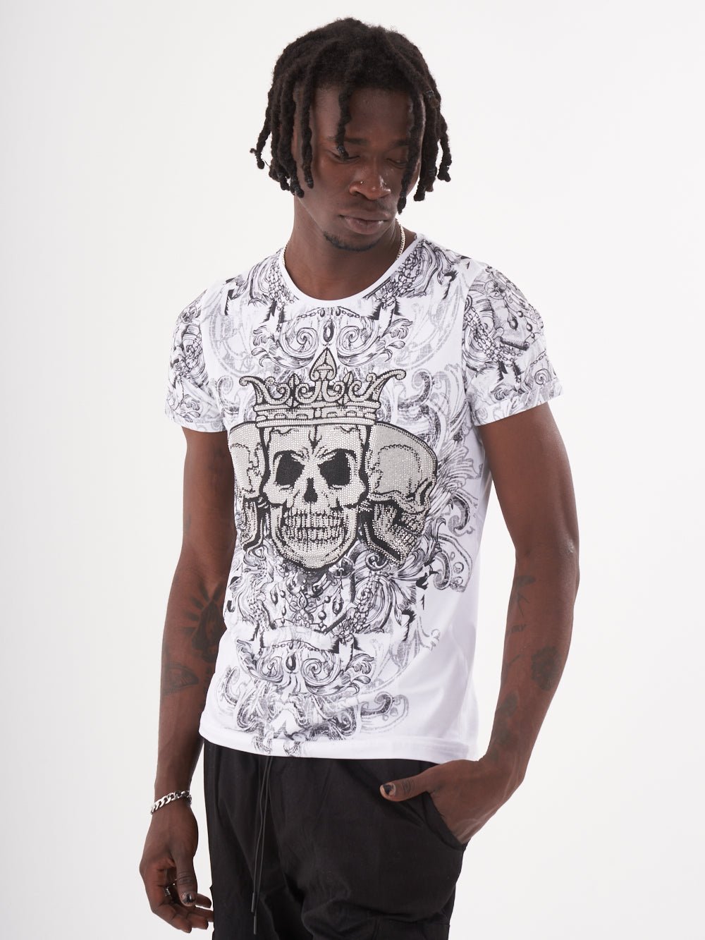 A man wearing an edgy, gothic-inspired Trinity T-shirt, showcasing his fashion game.