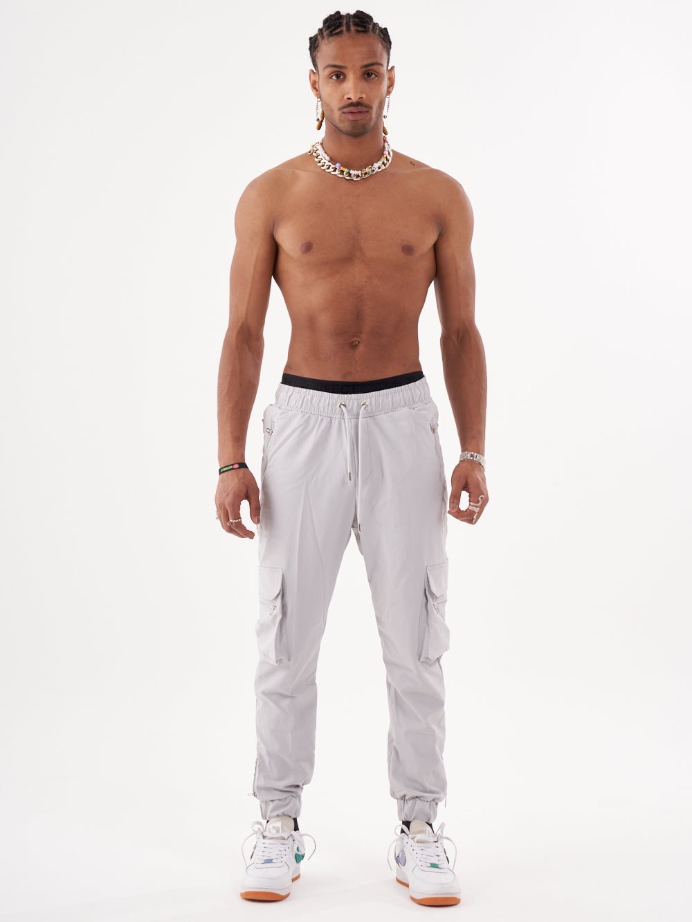 A man wearing ANARCHY JOGGERS and a tank top.