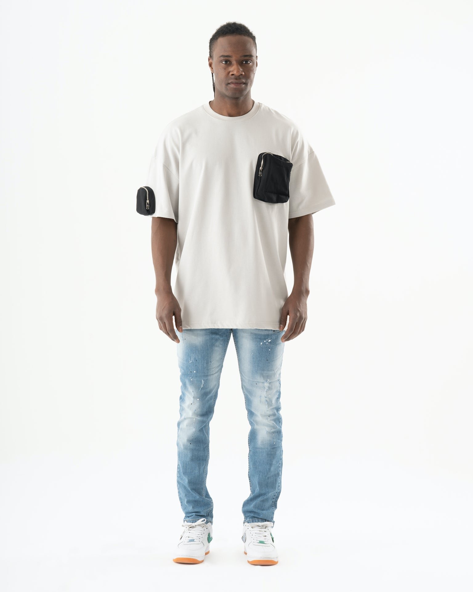 A man wearing SKATER jeans and a white t-shirt.